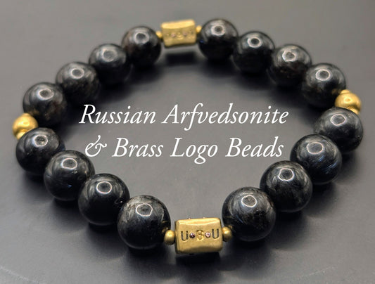 UBU Signature Arfvedsonite & Brass Logo Beads